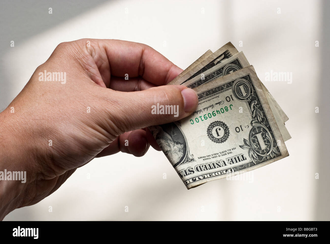 Dollar bills in a male part Banque D'Images