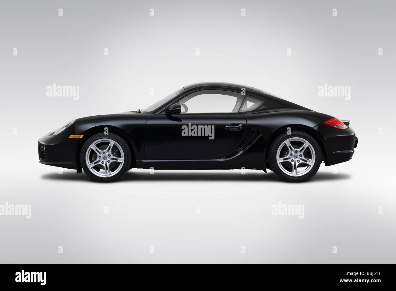 2009 Porsche Cayman en noir - Pilotes Portrait Banque D'Images