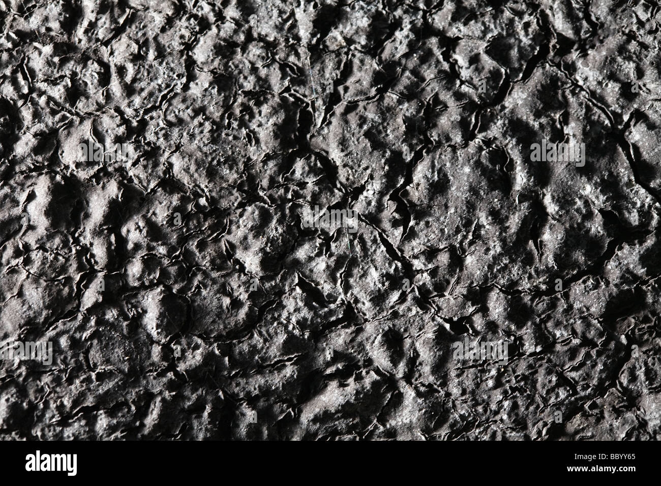 La texture de surface noire gercées comme un abstract background Banque D'Images