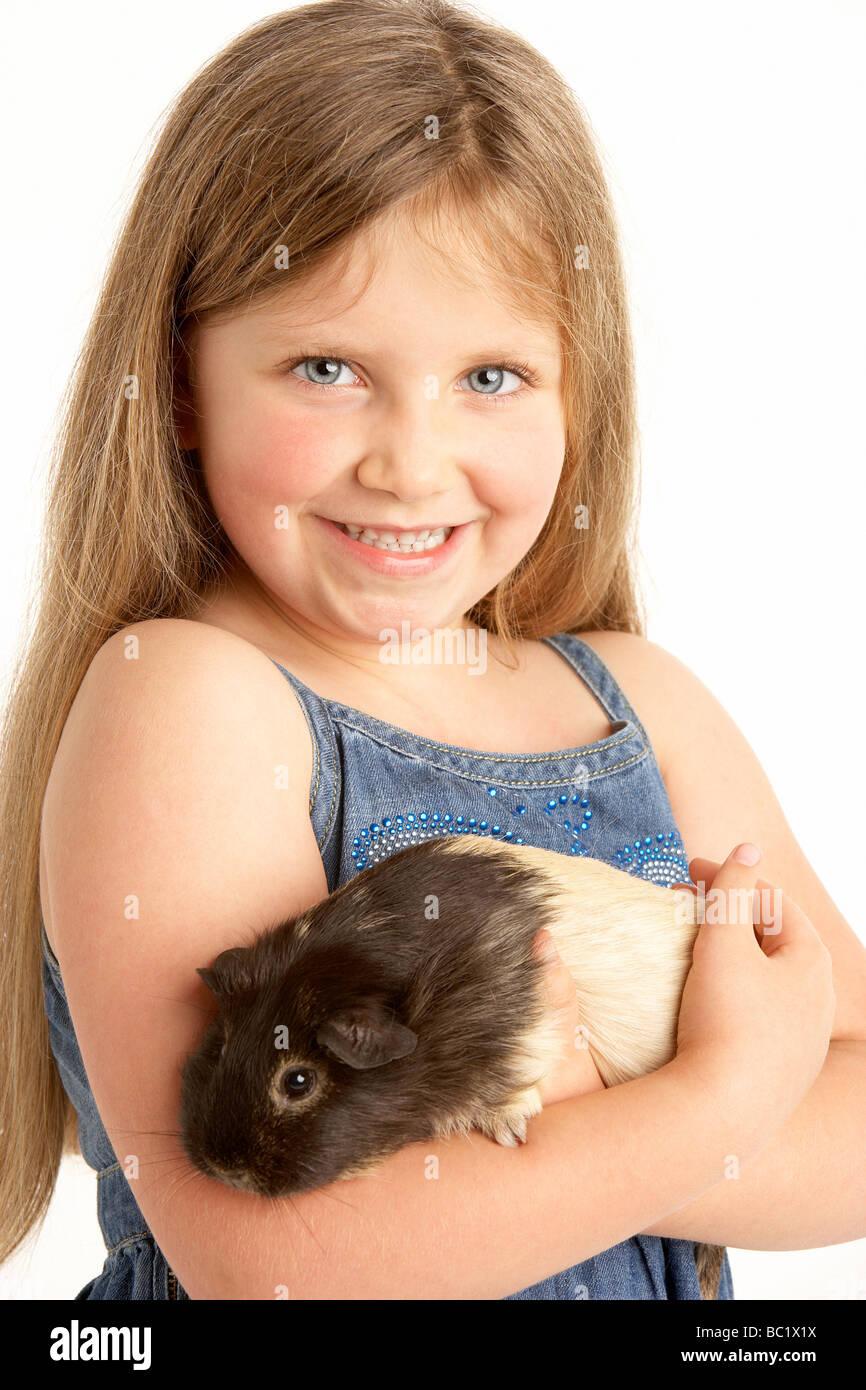 Young Girl Holding Animal Cochon Banque D'Images