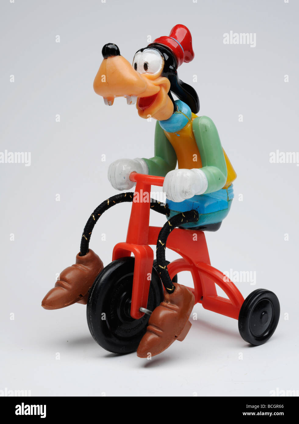Circonscription de Pluton sur son tricycle Banque D'Images