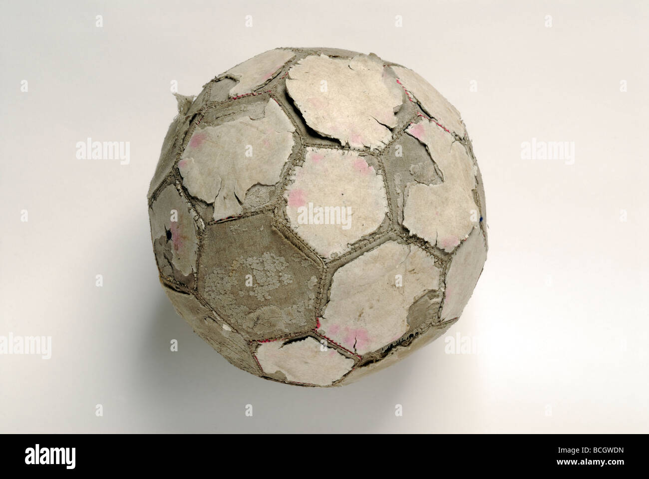 Tatty football on white Banque D'Images