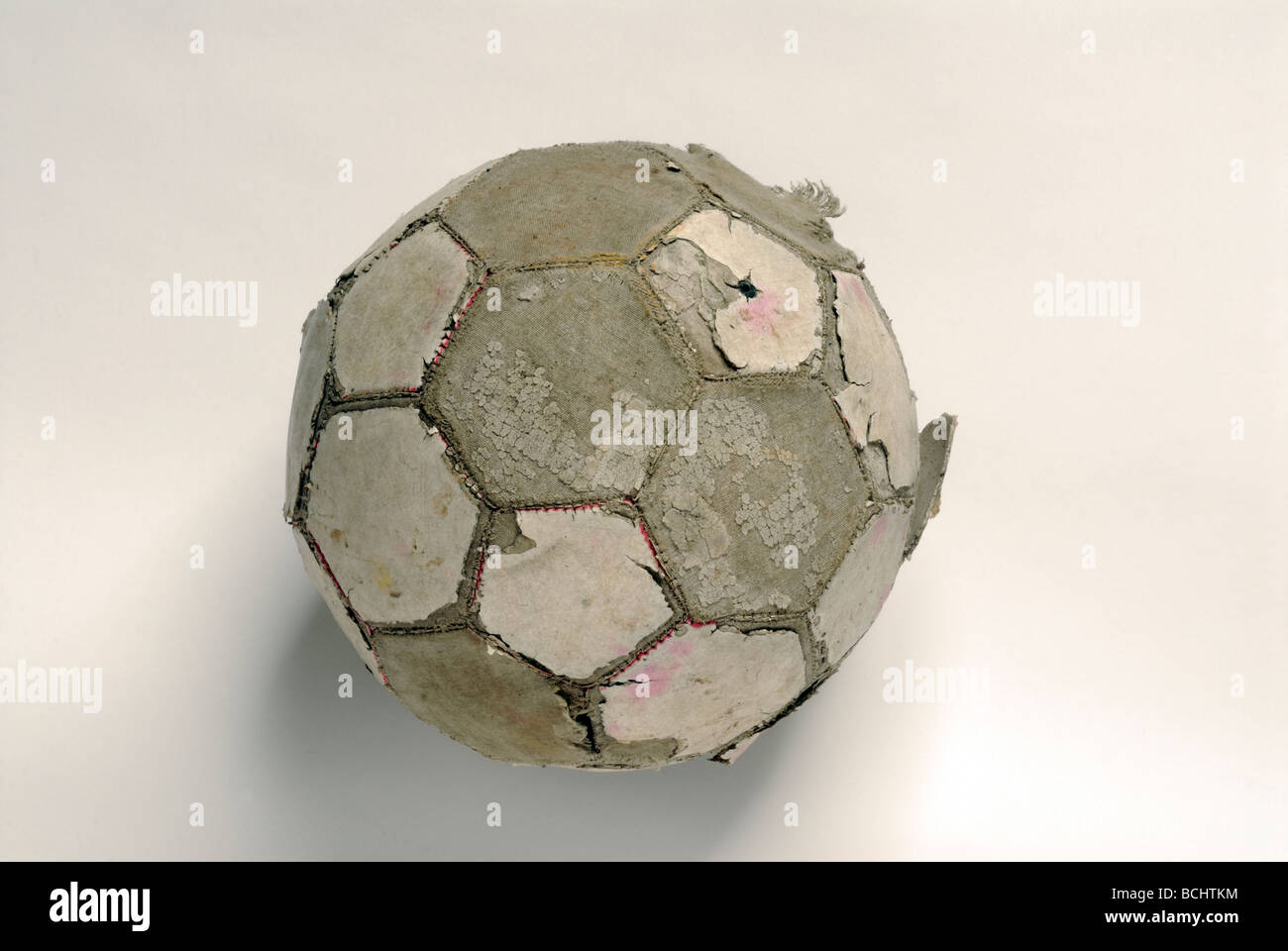 Tatty football on white Banque D'Images