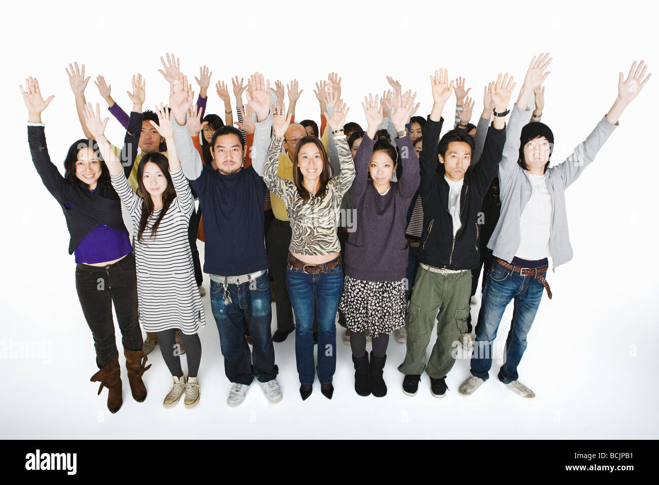 People with arms raised Banque D'Images