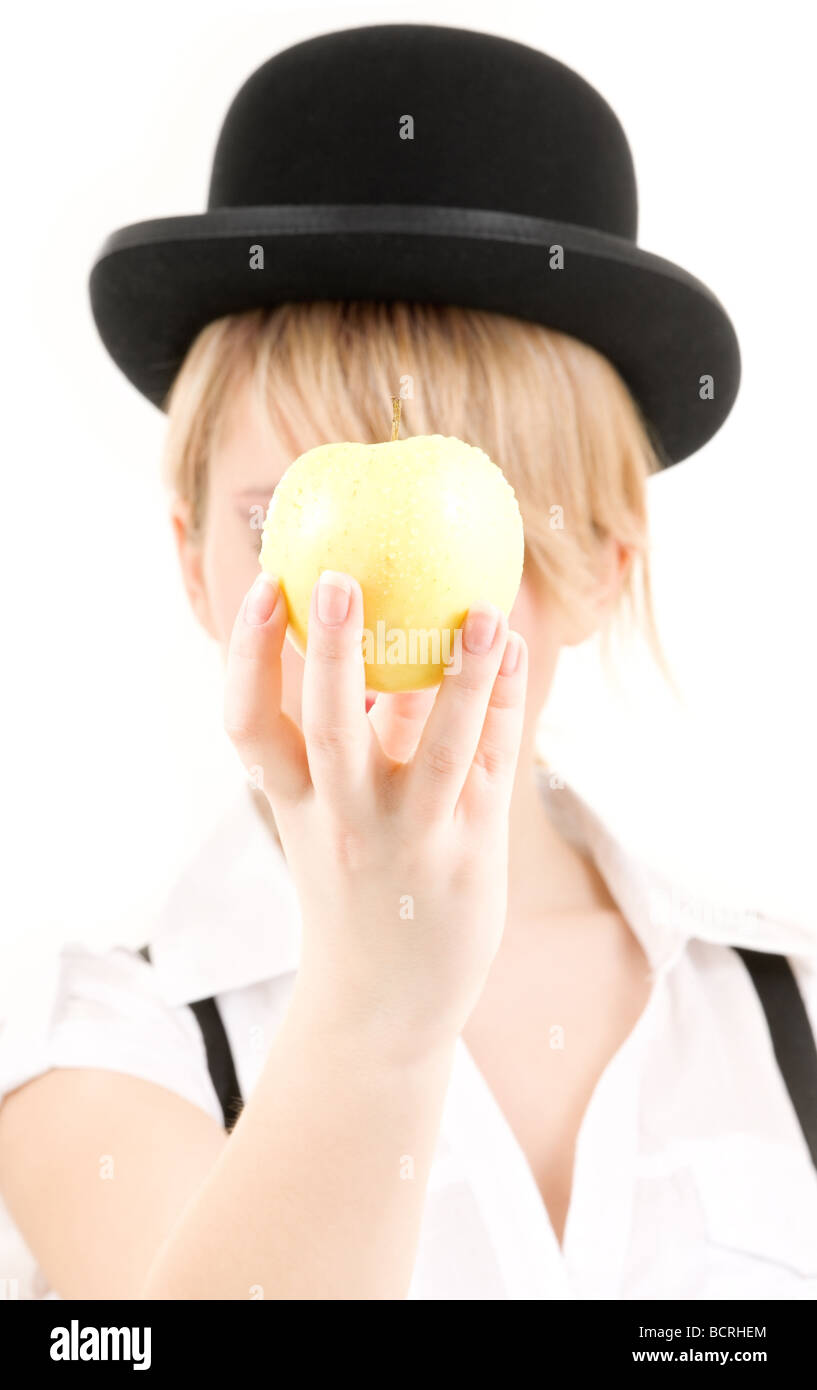 Pomme sur chapeau melon Banque de photographies et d'images à haute  résolution - Alamy