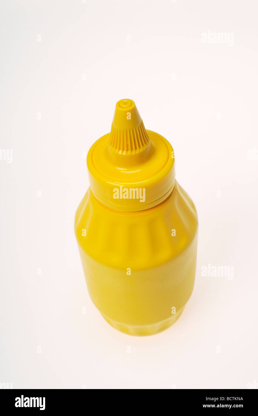 La moutarde jaune bouteille pas d'étiquette sur fond blanc. Banque D'Images