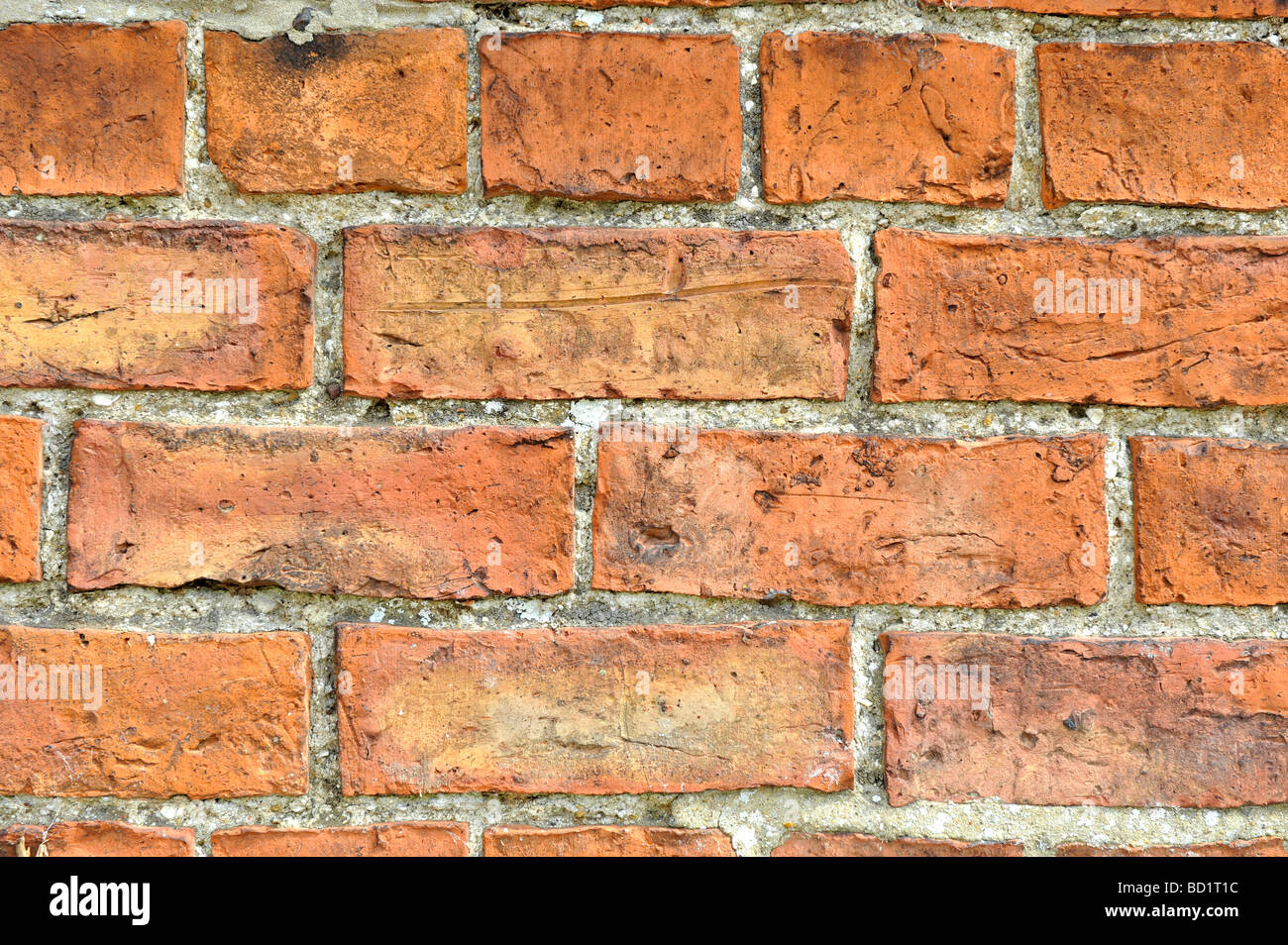 Un gros plan d'un mur de brique en pierre rouge Banque D'Images