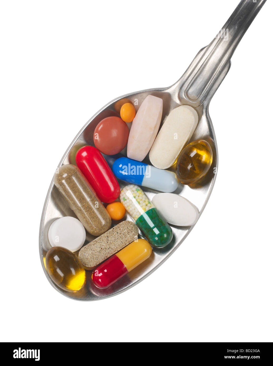 Assorted pills in spoon elevated view Banque D'Images