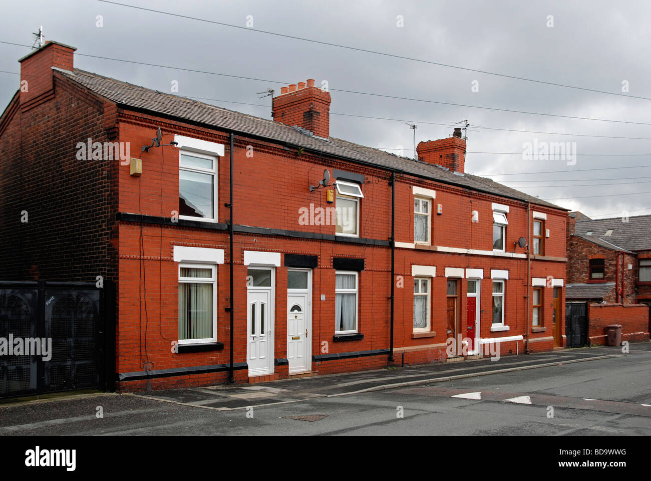 Une rangée de maisons du début du xxe siècle dans la région de Wigan, lancashire, uk Banque D'Images
