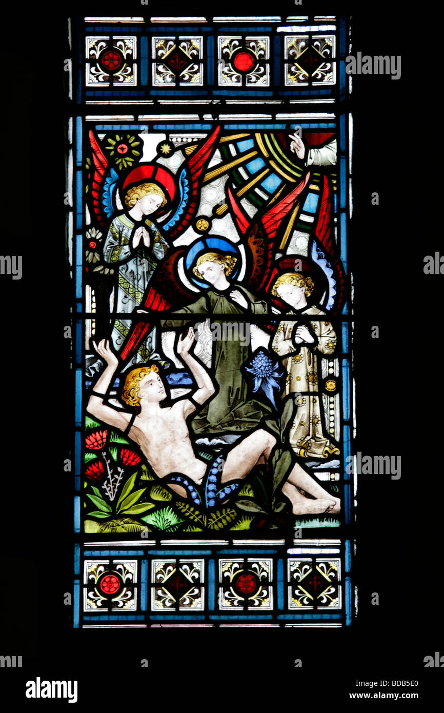 Vitraux de 1872 par Bell & Almond représentant la Genèse 1 26; la création d'Adam, église Earls Barton, Northamptonshire, Angleterre Banque D'Images