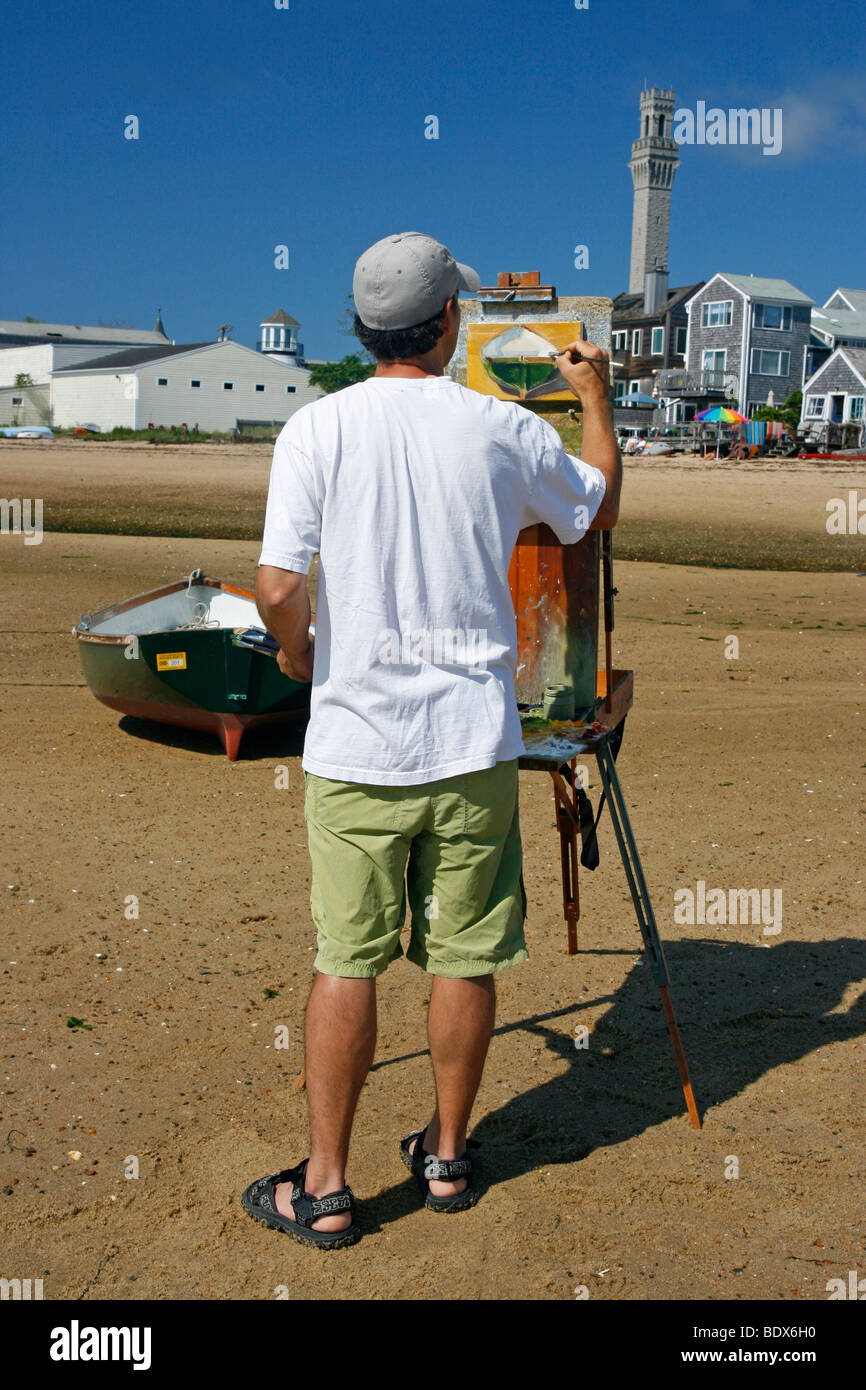 La peinture de l'artiste masculin une photo d'un bateau à Provincetown, Cape Cod, Massachusetts, États-Unis. Banque D'Images
