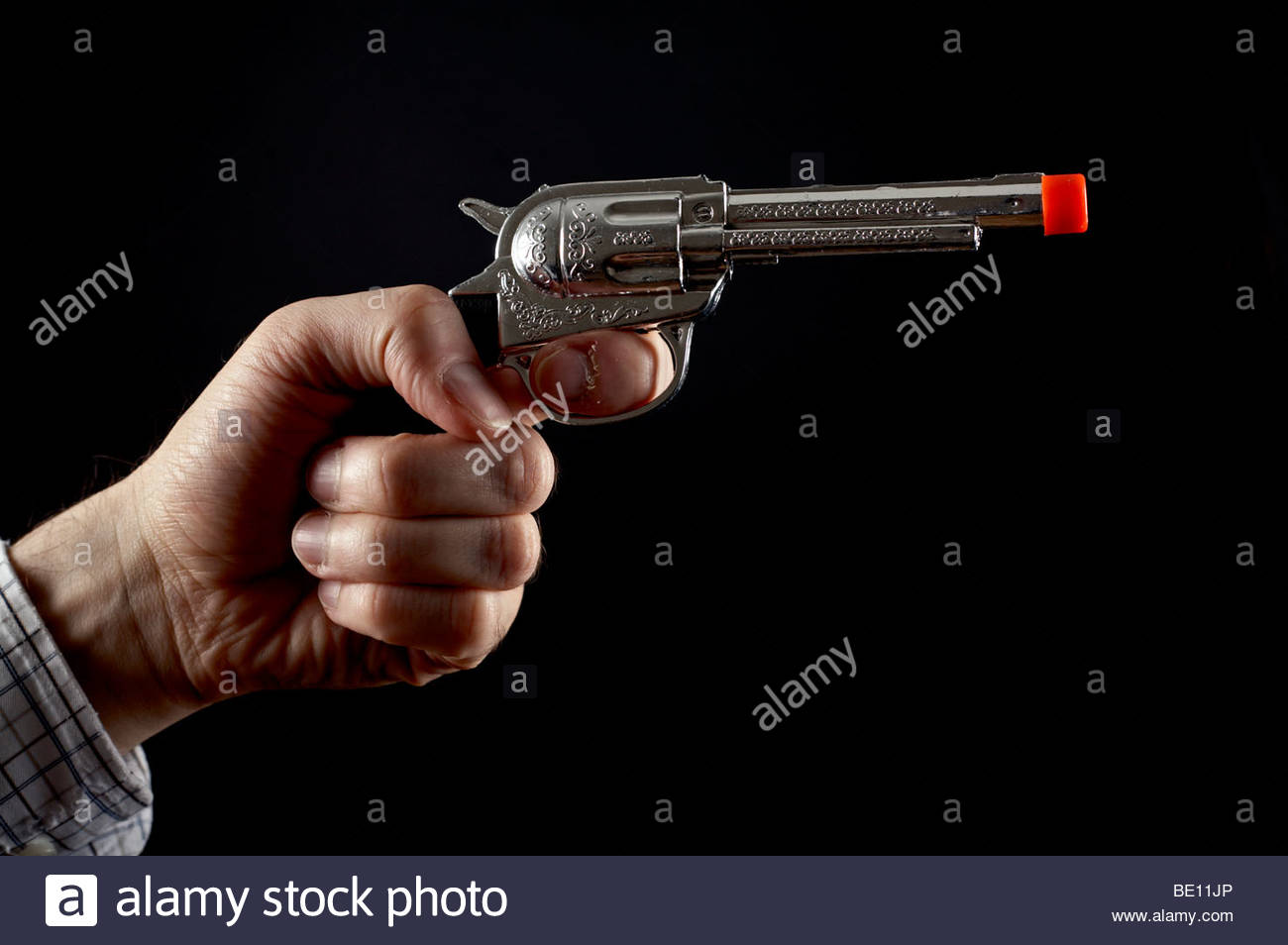 Man holding toy gun Banque D'Images