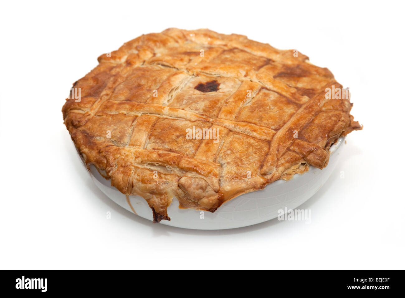 Steak and kidney pie isolated on a white background studio. Banque D'Images