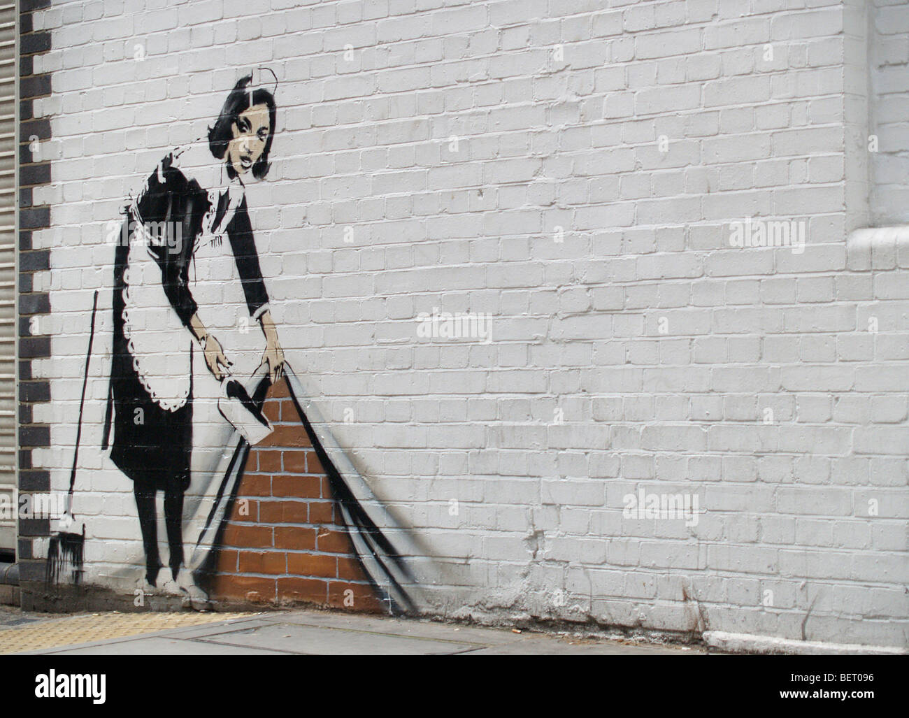 Stencil Banksy graffiti, nettoyant ménage, Londres Banque D'Images