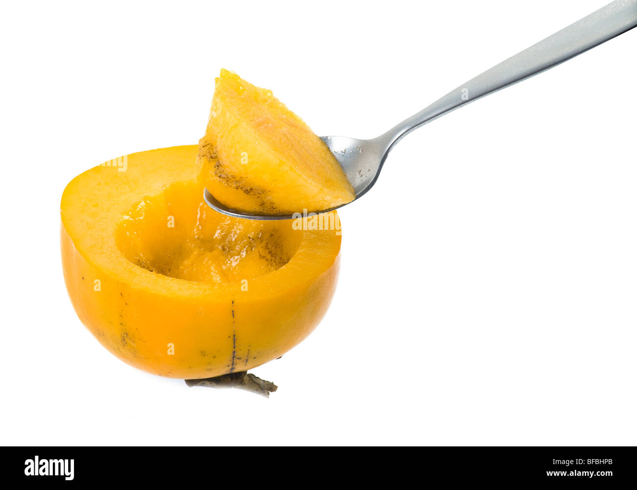 Manger Manger kaki kaki Diospyros kaki Sharon fruit persimone Ebenaceae Japanese persimmon Diospyros Kakifruit découpe cuillère Banque D'Images