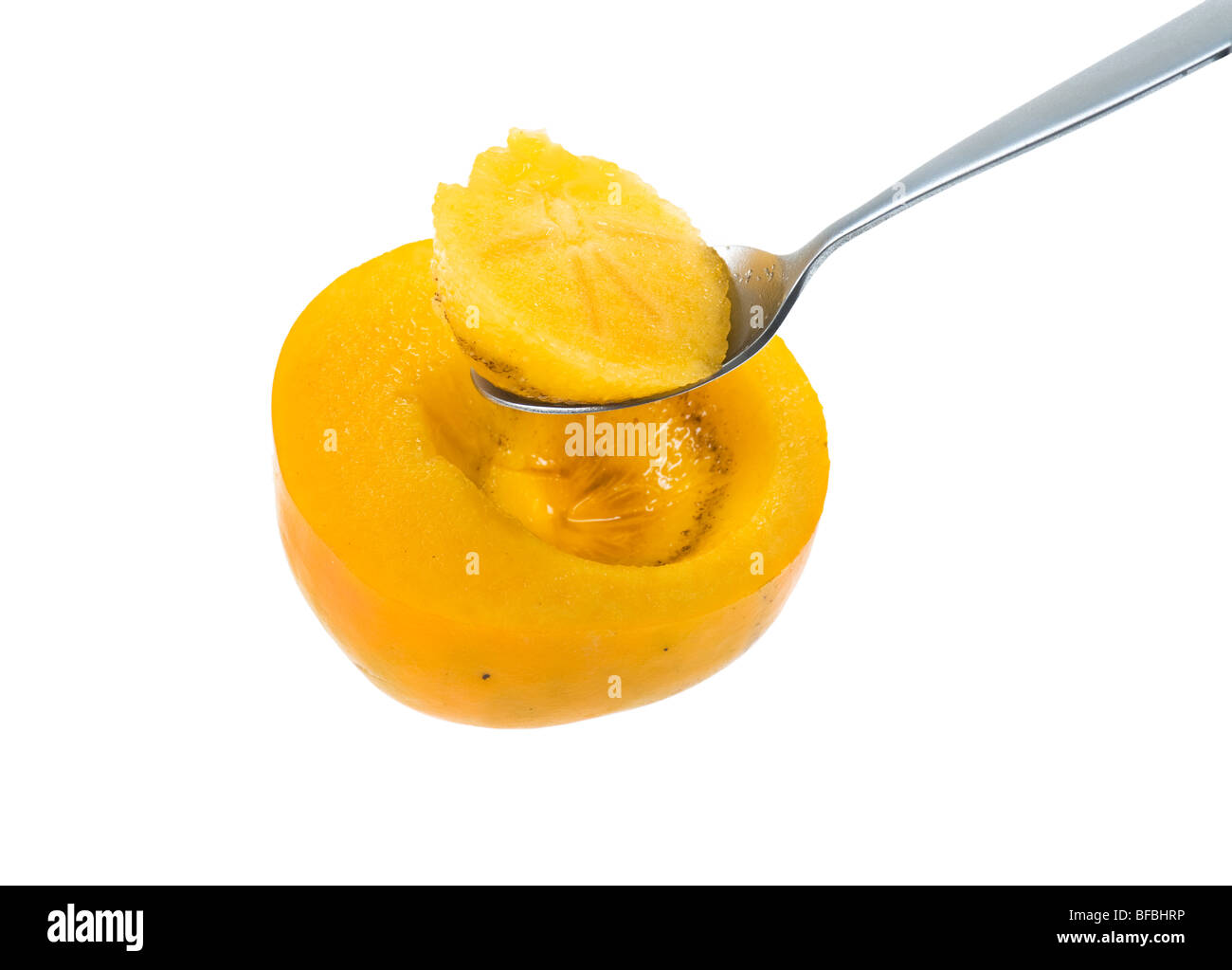 Manger Manger kaki kaki Diospyros kaki Sharon fruit persimone Ebenaceae Japanese persimmon Diospyros Kakifruit découpe cuillère Banque D'Images