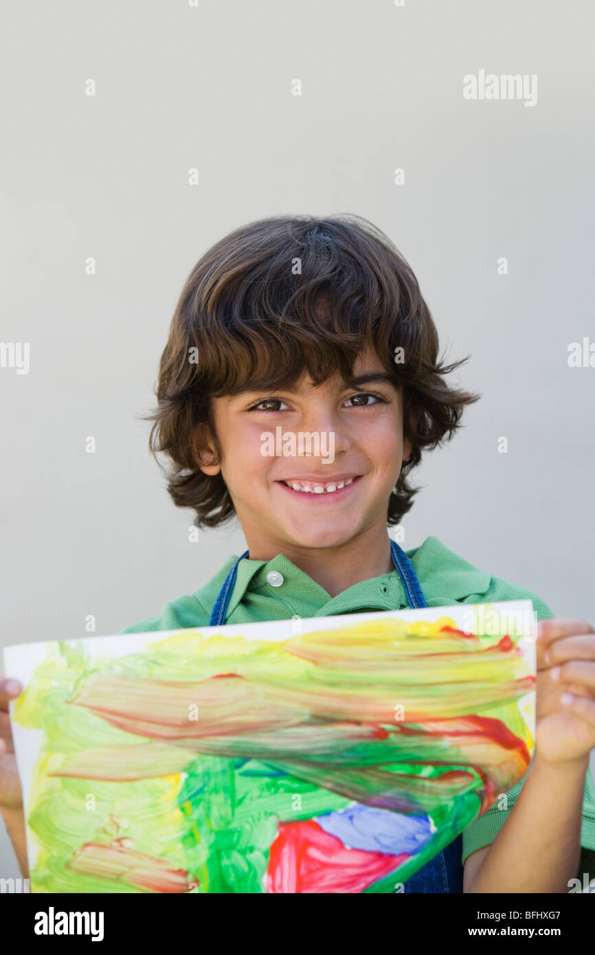 Boy Showing Off Peinture Banque D'Images