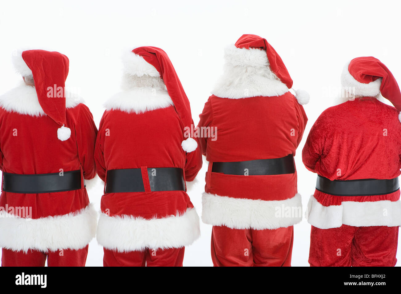 Groupe d'hommes habillés en Père Noël, vue arrière Banque D'Images
