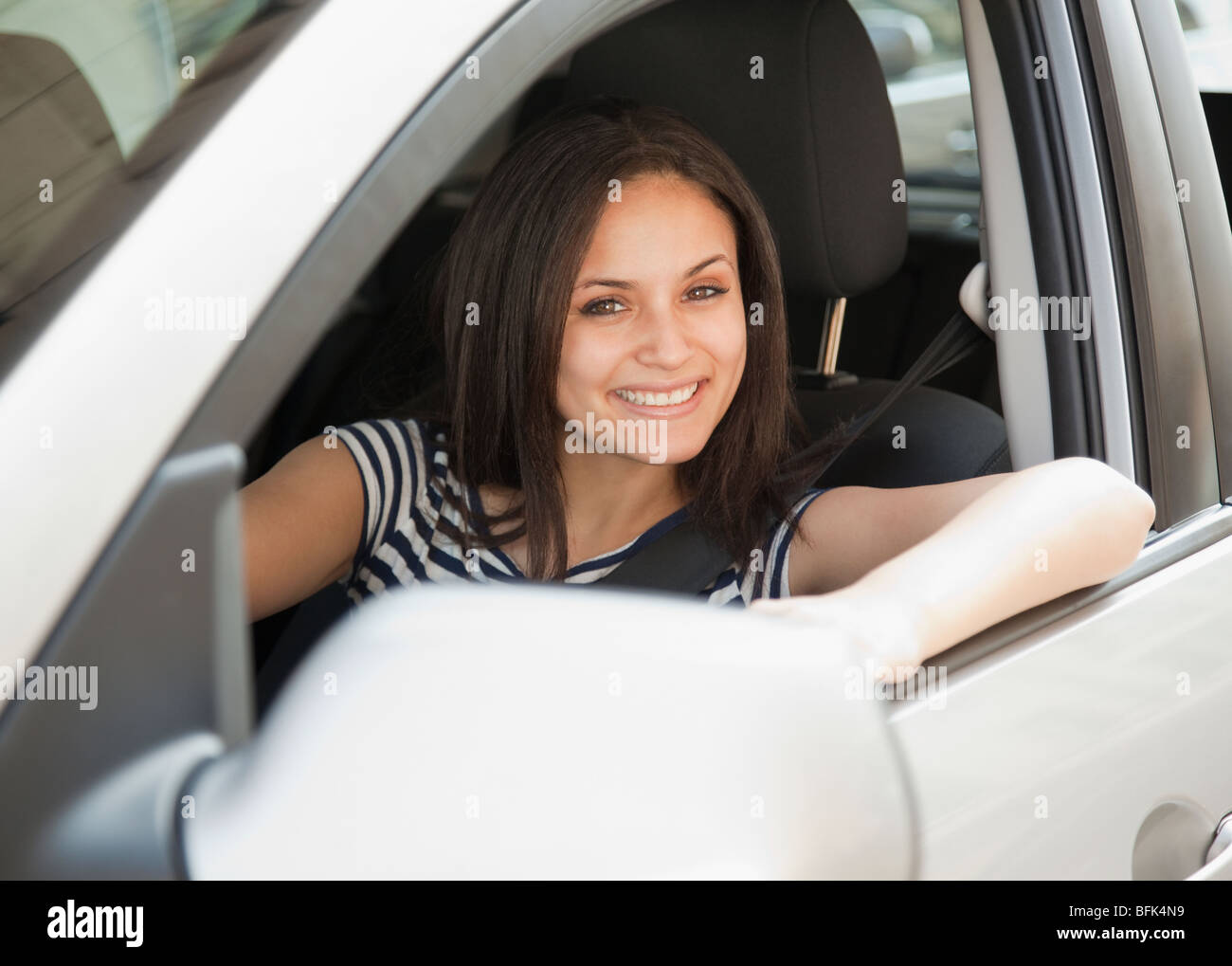 Mixed Race woman driving car Banque D'Images