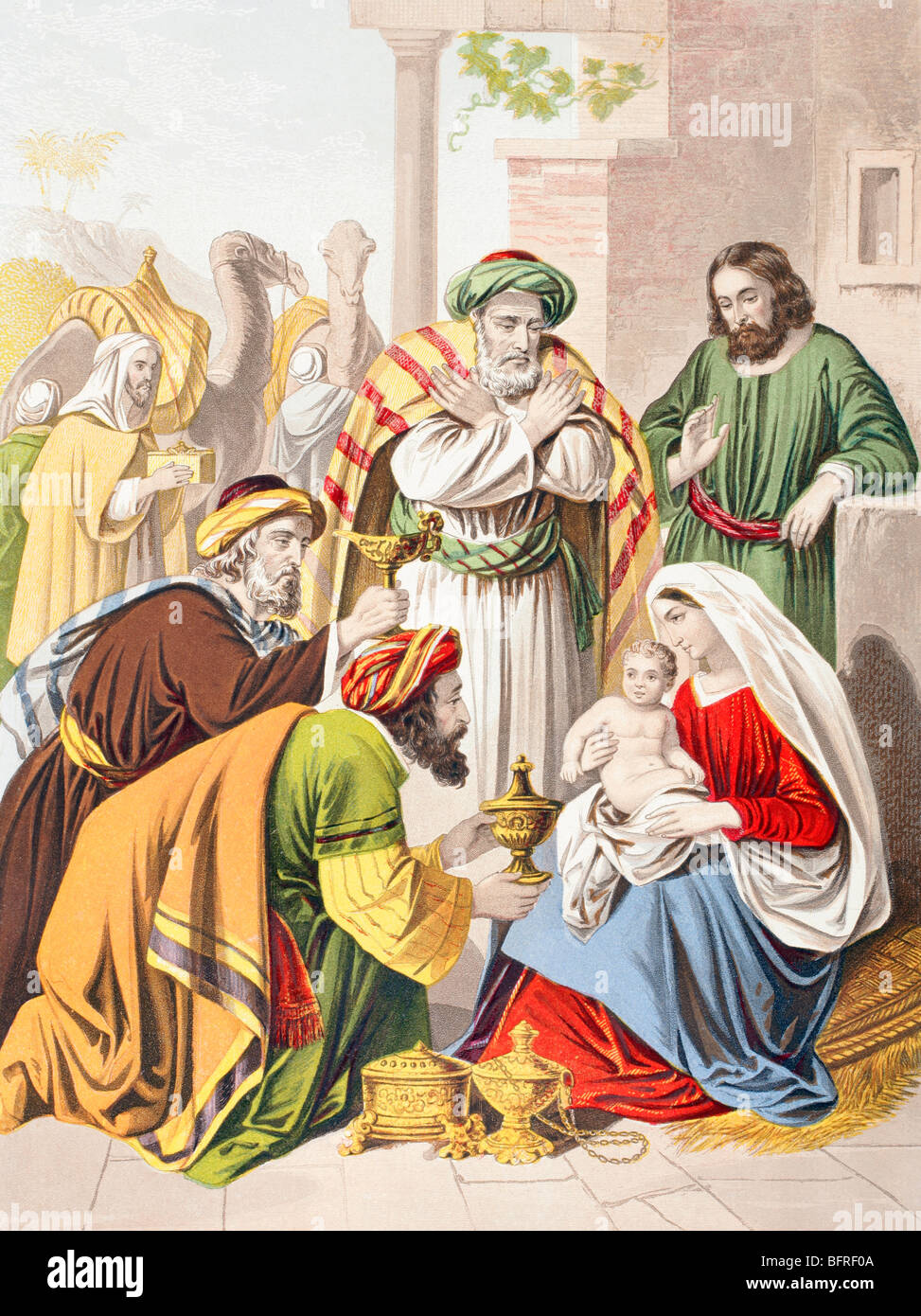 Scène de la nativité. Les trois sages avec la Sainte Famille. L'un présente un cadeau à l'enfant Jésus. Banque D'Images