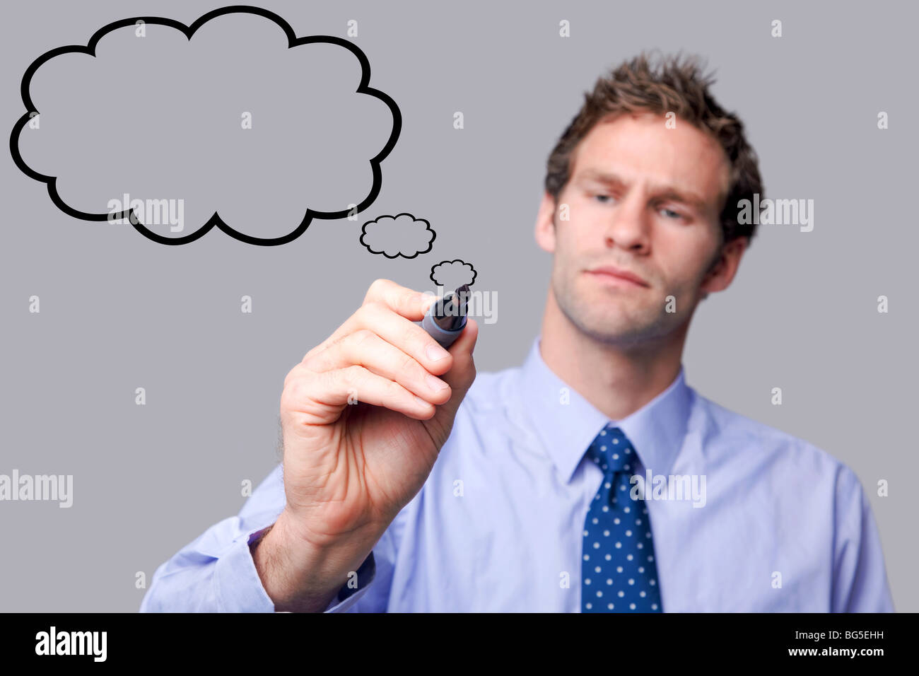 Businessman drawing a bulle pensée Banque D'Images