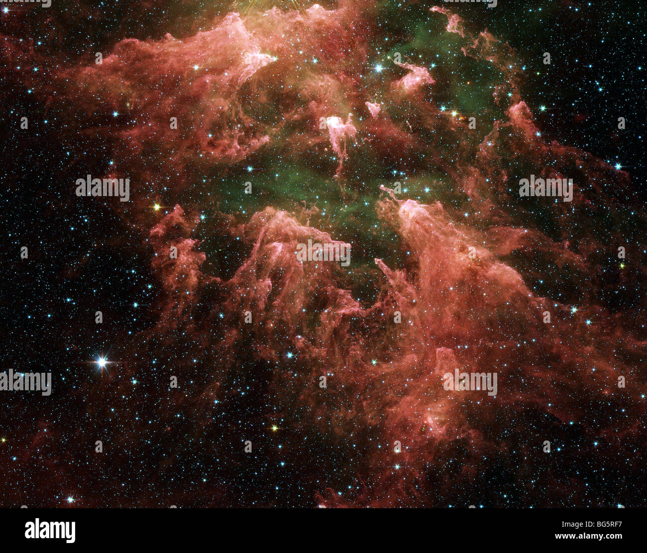 Cette image en fausses couleurs prise par le télescope spatial Spitzer de la NASA montre la "sud pilier" Région de la nébuleuse Carina. Banque D'Images