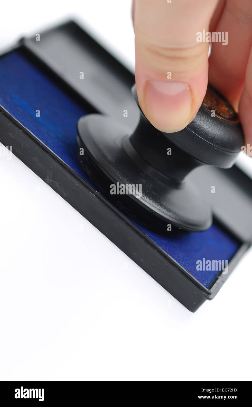 La main avec tampon sur un fond blanc Banque D'Images