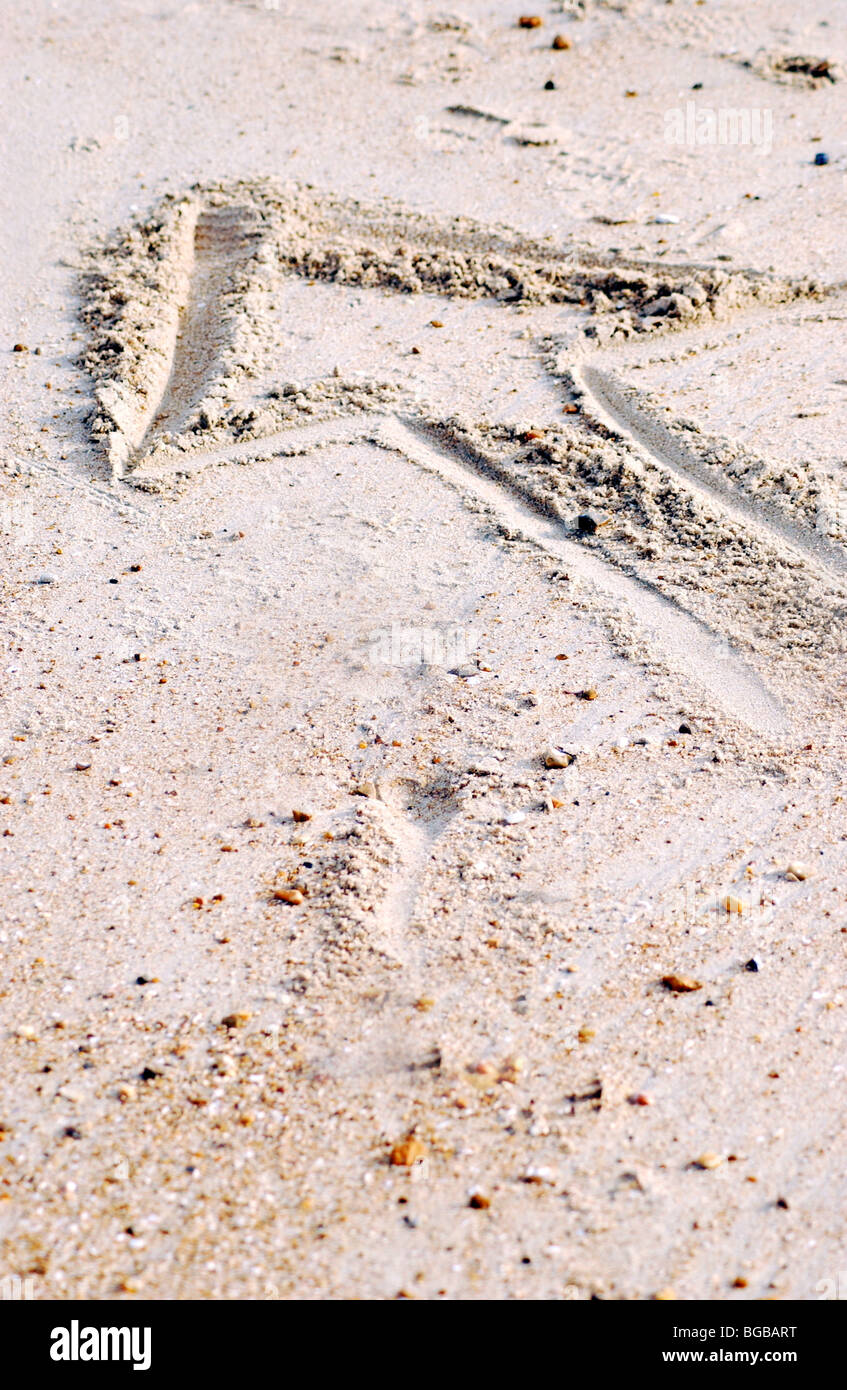 Photographie de la flèche vers l'avant du sable succès lucratif UK Banque D'Images