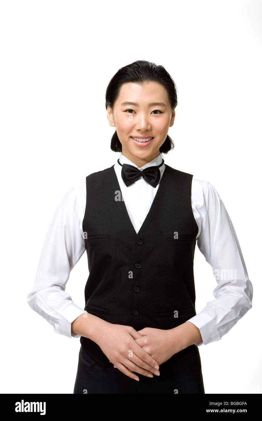 Le personnel de service souriant Banque D'Images