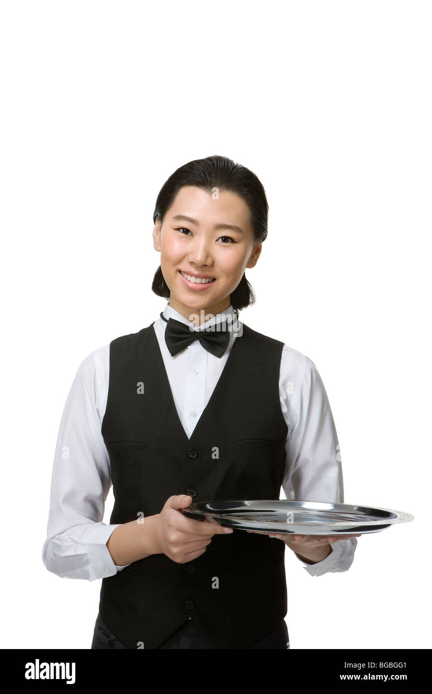 Le personnel de service souriant Banque D'Images