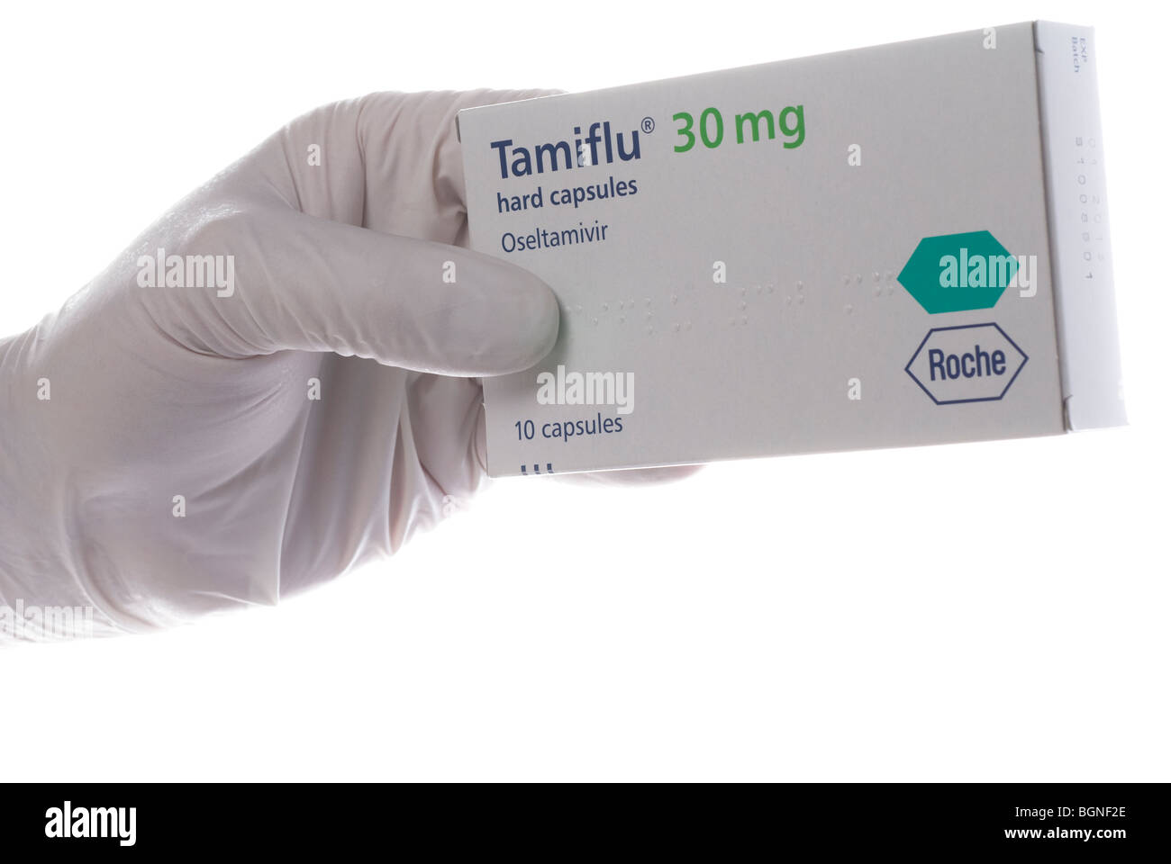 Tamiflu fort tenu par une main gantée blanc avec un espace réservé au texte ou réactivation Banque D'Images