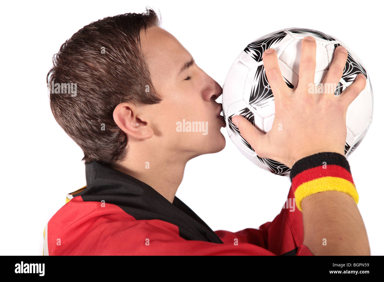 Un jeune allemand fan de foot.Tous les isolé sur fond blanc. Banque D'Images