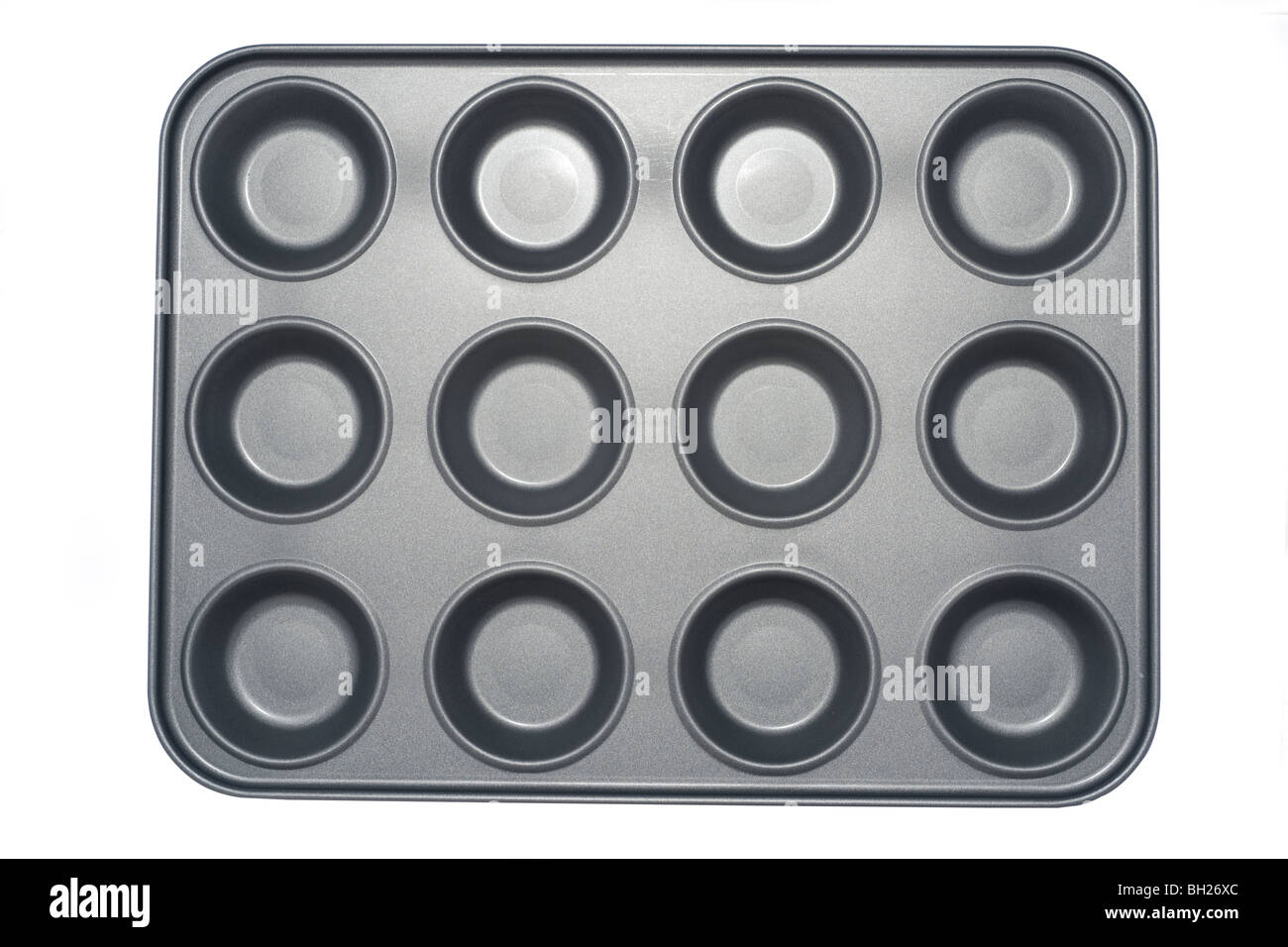 Douze des sections de métal gris recouvert de téflon bac muffin Banque D'Images