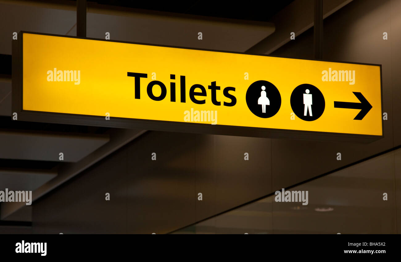 Toilettes Hommes et femmes éclairés à l'aéroport inscription Banque D'Images