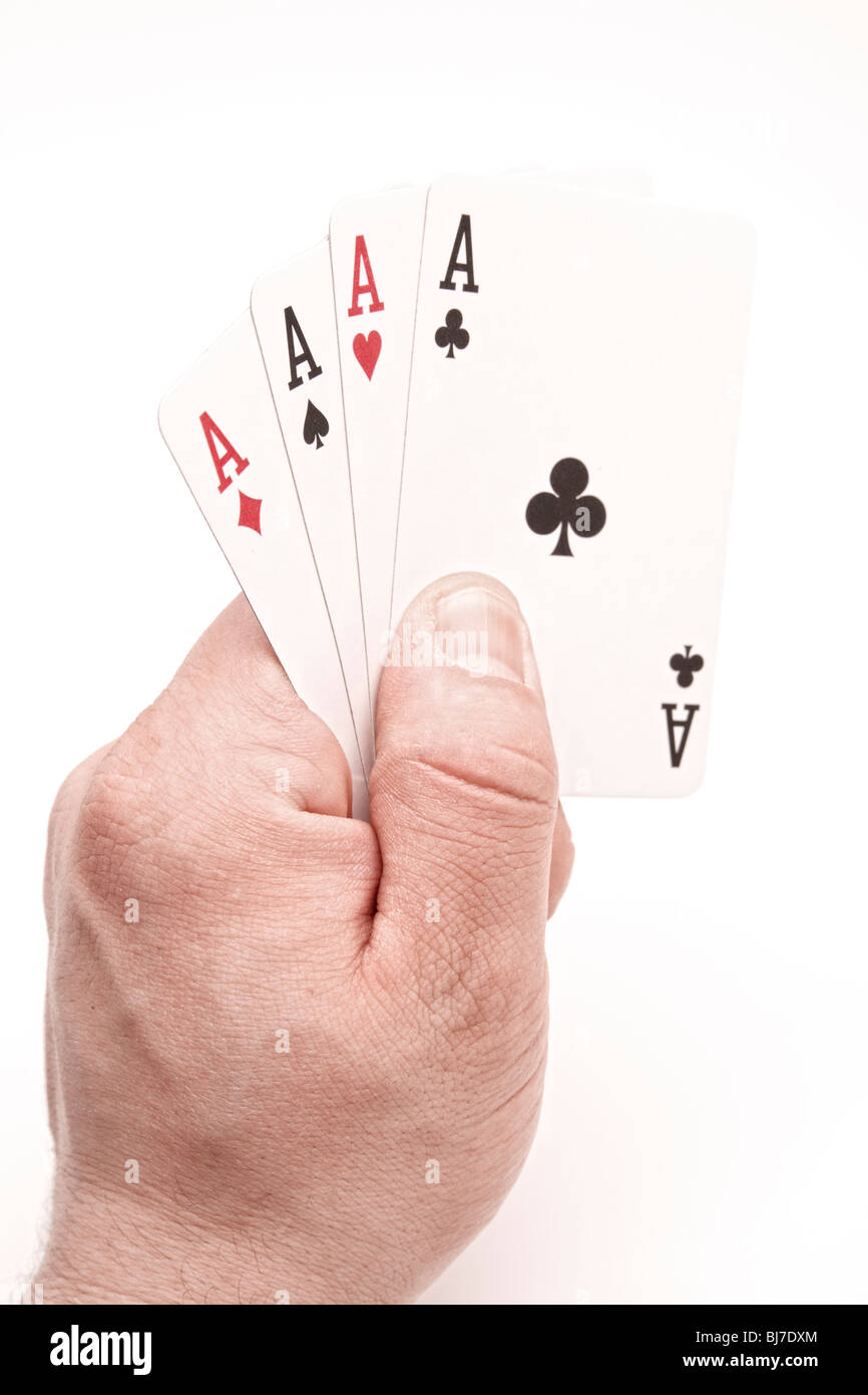Quatre As dans la main on white Banque D'Images