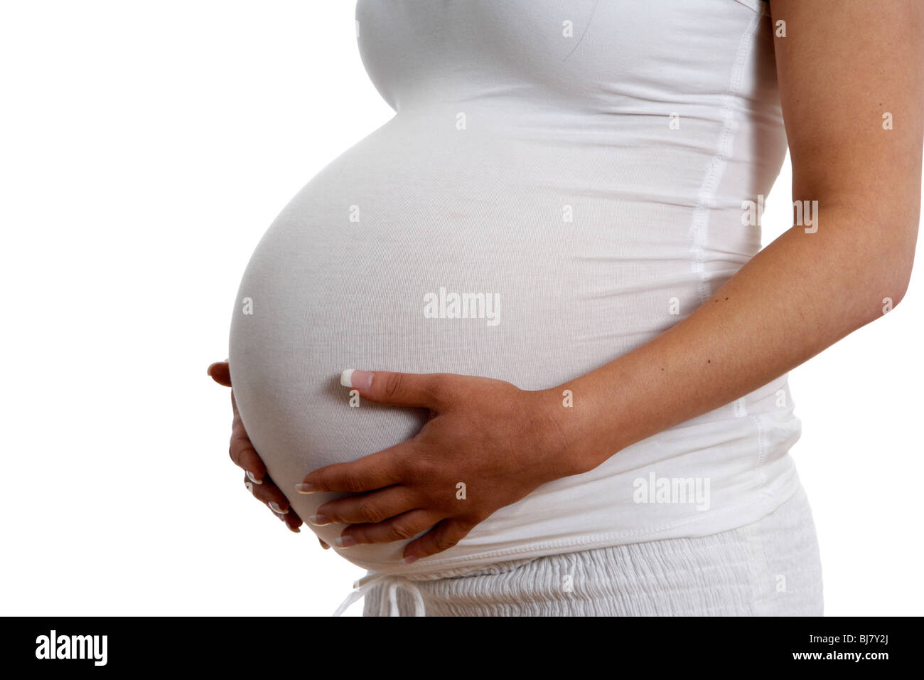 8 mois femme enceinte de 30 ans holding baby bump Banque D'Images