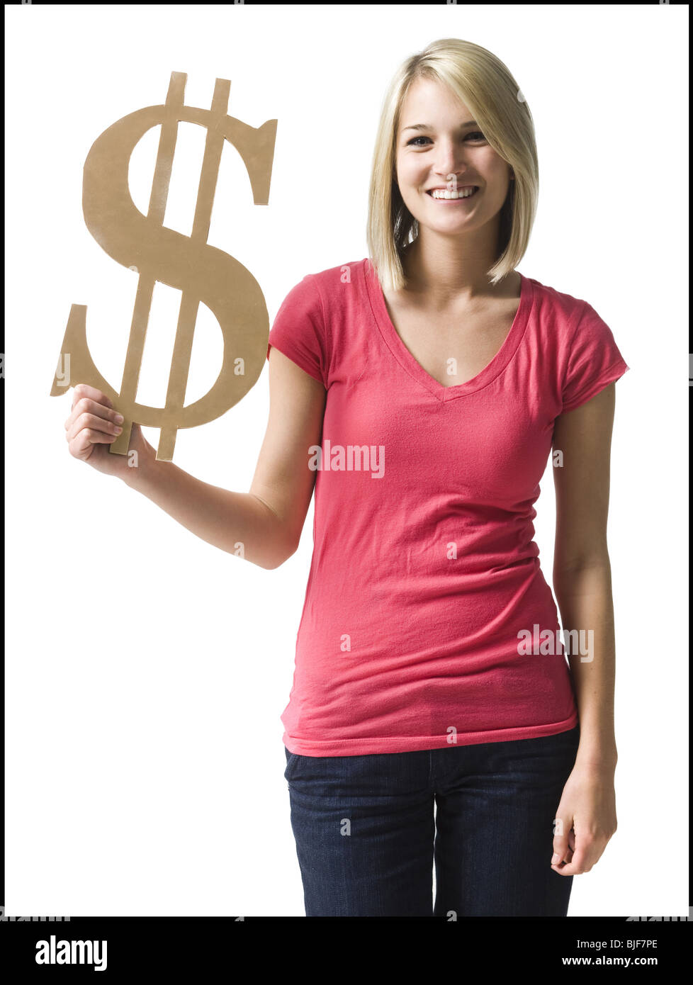 Woman holding up symbole du dollar Banque D'Images