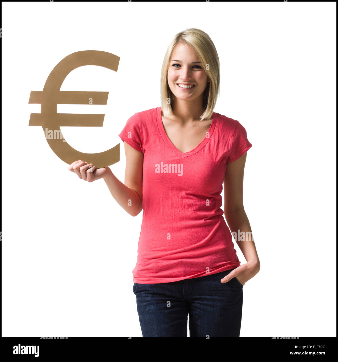 Woman holding up symbole euro Banque D'Images