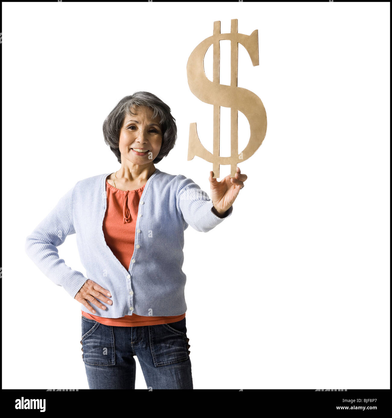 Femme tenant le symbole monétaire Banque D'Images