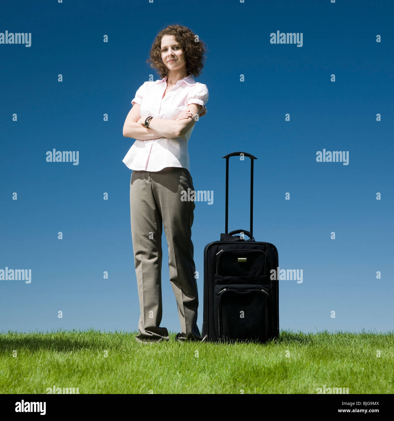 Portrait avec un rouleau à suitcase Banque D'Images