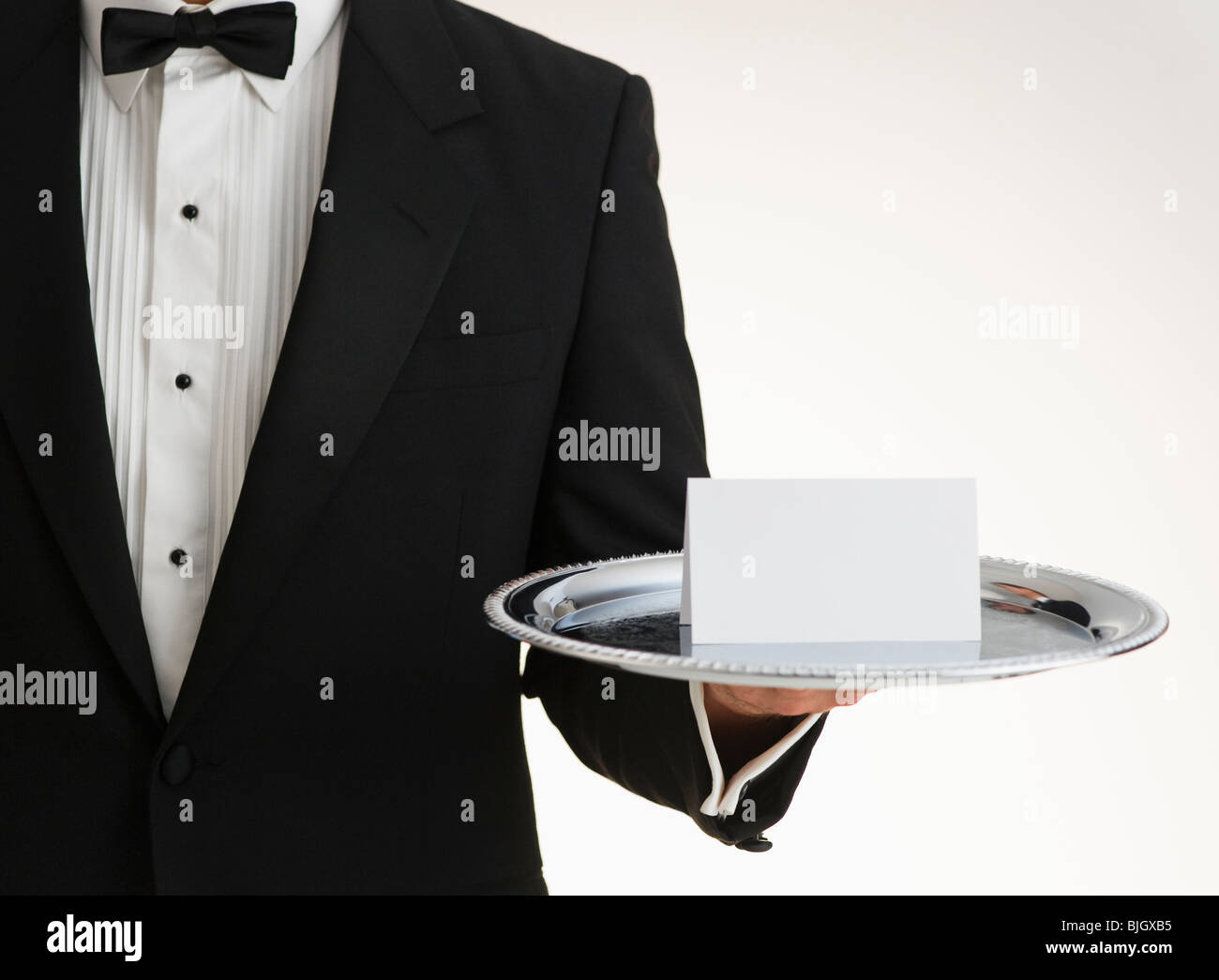 Butler holding silver tray Banque D'Images