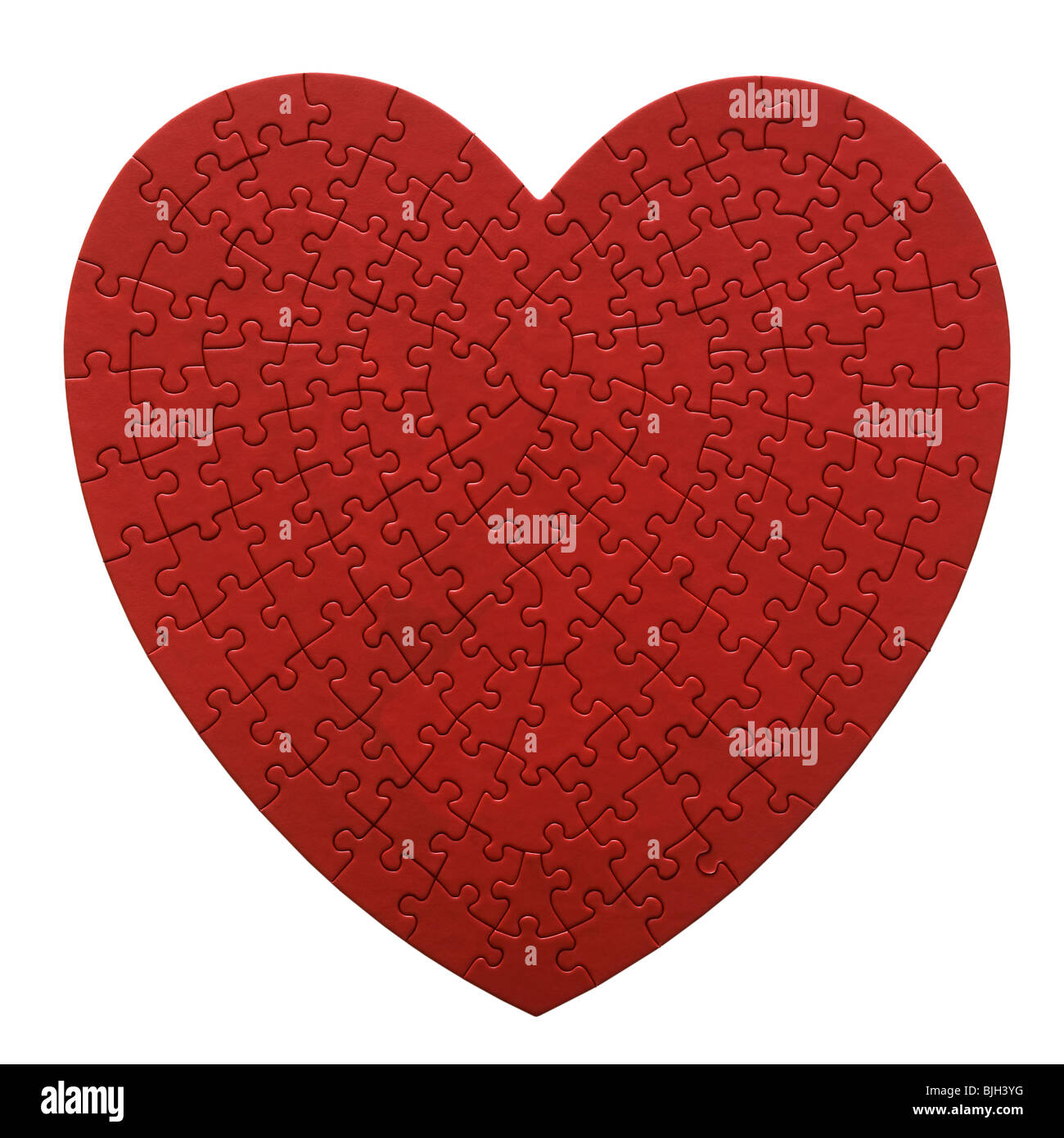 Puzzle en forme de coeur rouge sur fond blanc Banque D'Images