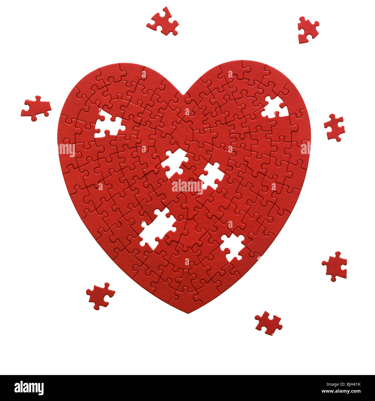 Puzzle en forme de coeur rouge sur fond blanc Banque D'Images