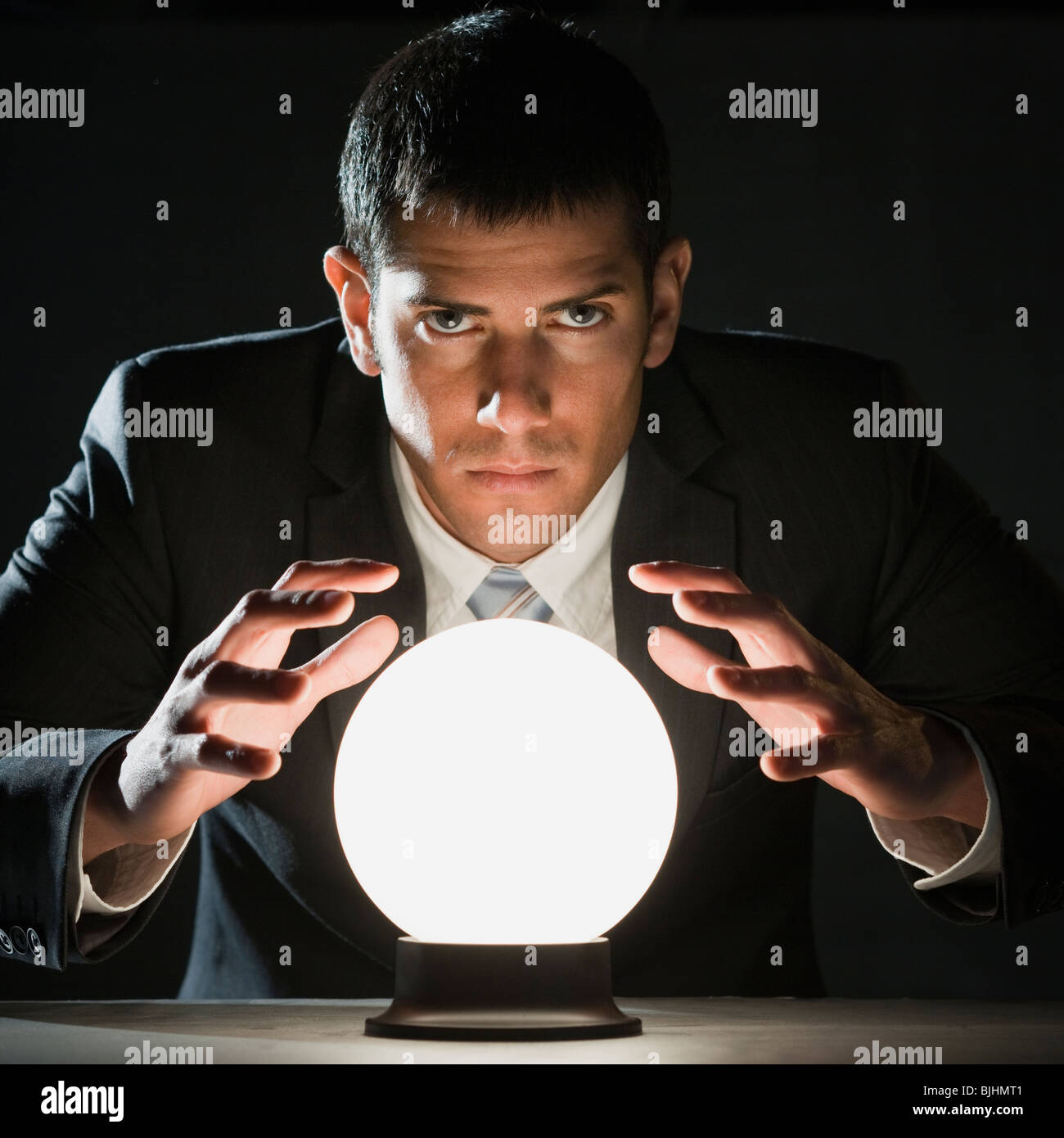 Businessman with Crystal Ball Banque D'Images