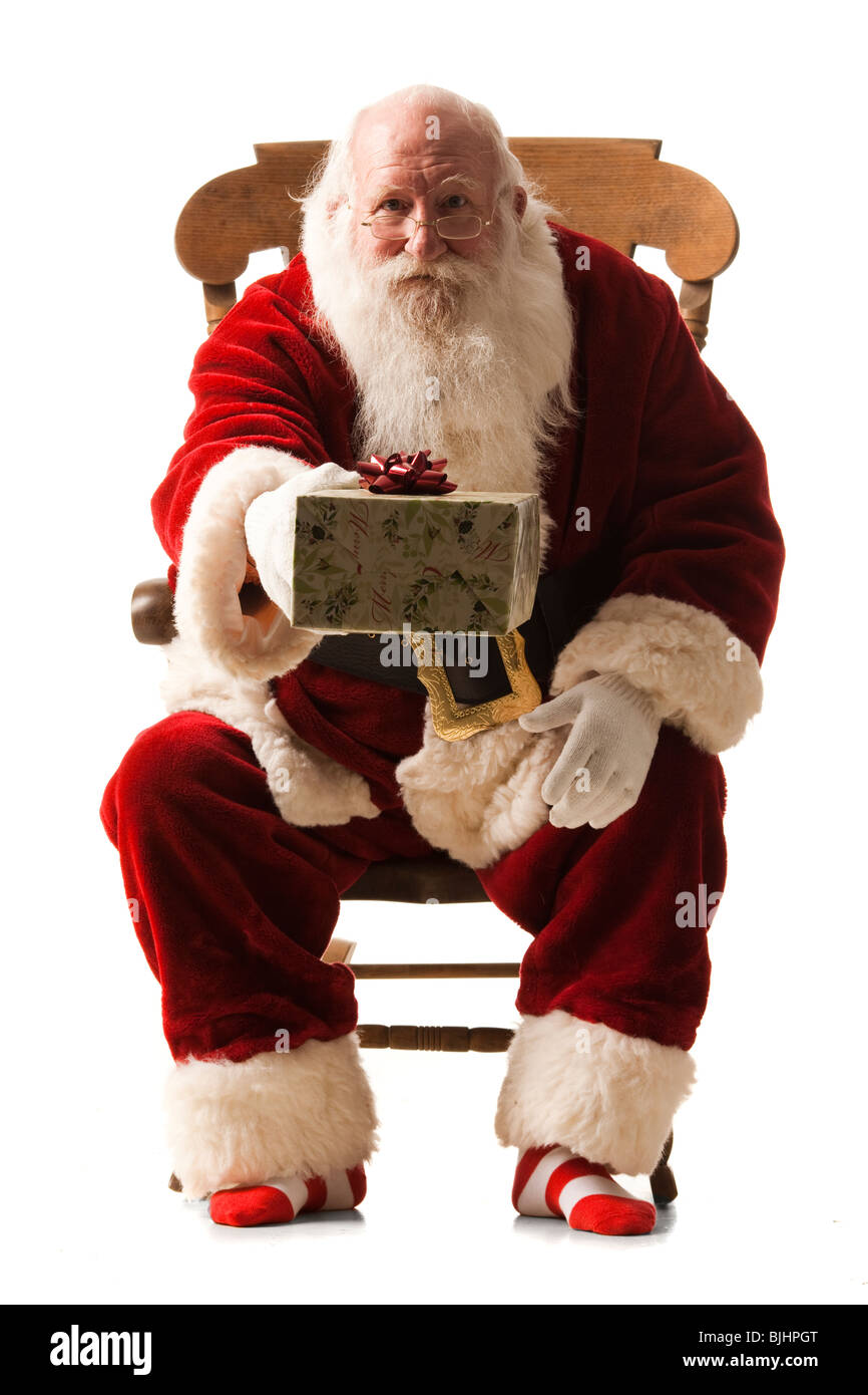 Santa Claus giving a present Banque D'Images