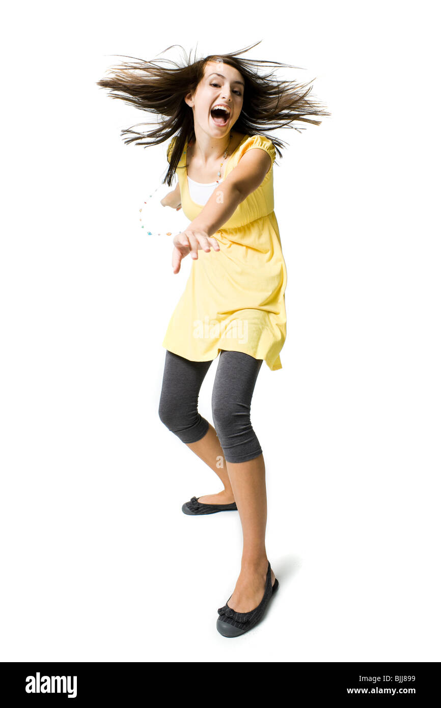 Teenage girl dancing and smiling Banque D'Images