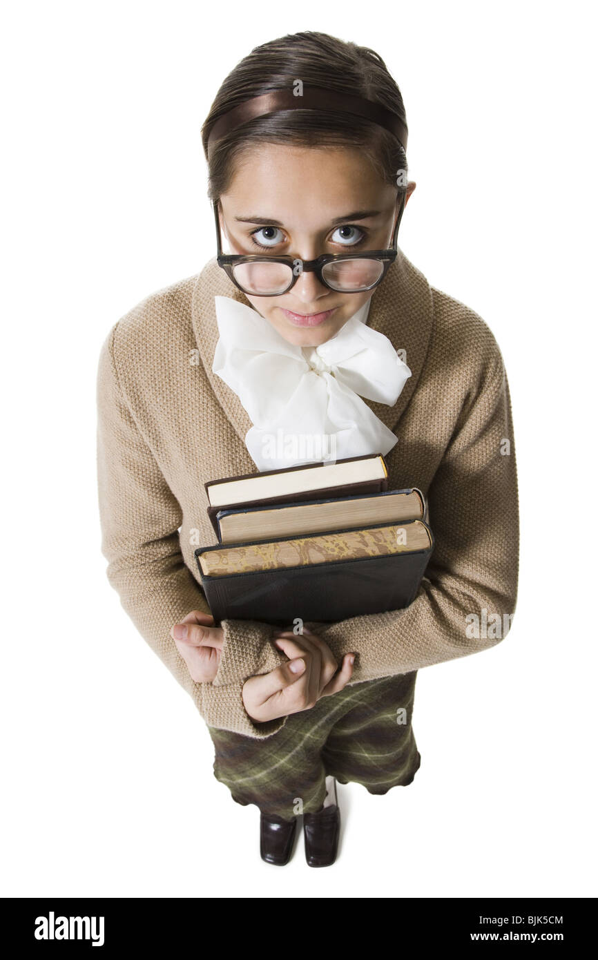 Bibliothécaire féminine avec des lunettes et des livres hushing Banque D'Images