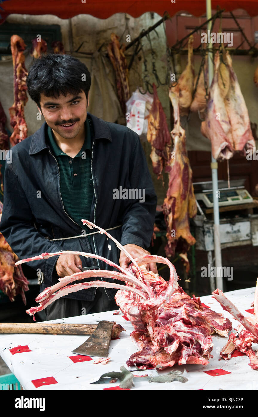L'ouïgour de Kashgar boucher local, la Chine. Banque D'Images