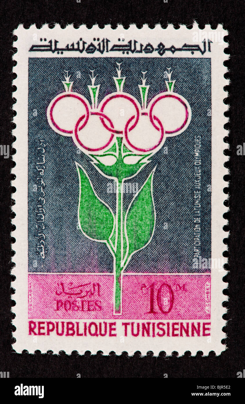 Timbre-poste de Tunisie symboliquement décrivant la torche des Jeux Olympiques (Rome, 1960) Banque D'Images