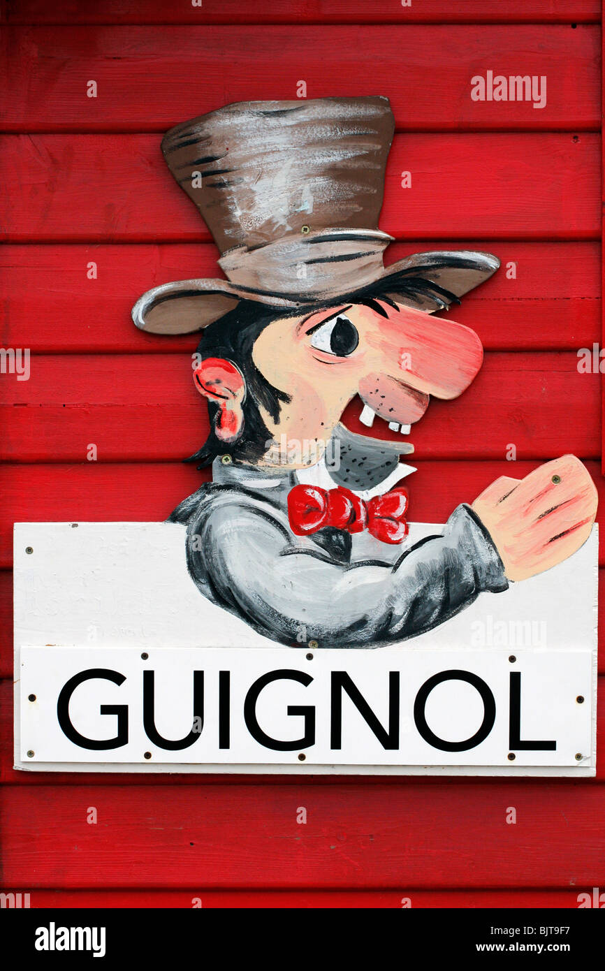 Inscription peinte à la main de la marionnette guignol publicité en Bretagne France Banque D'Images
